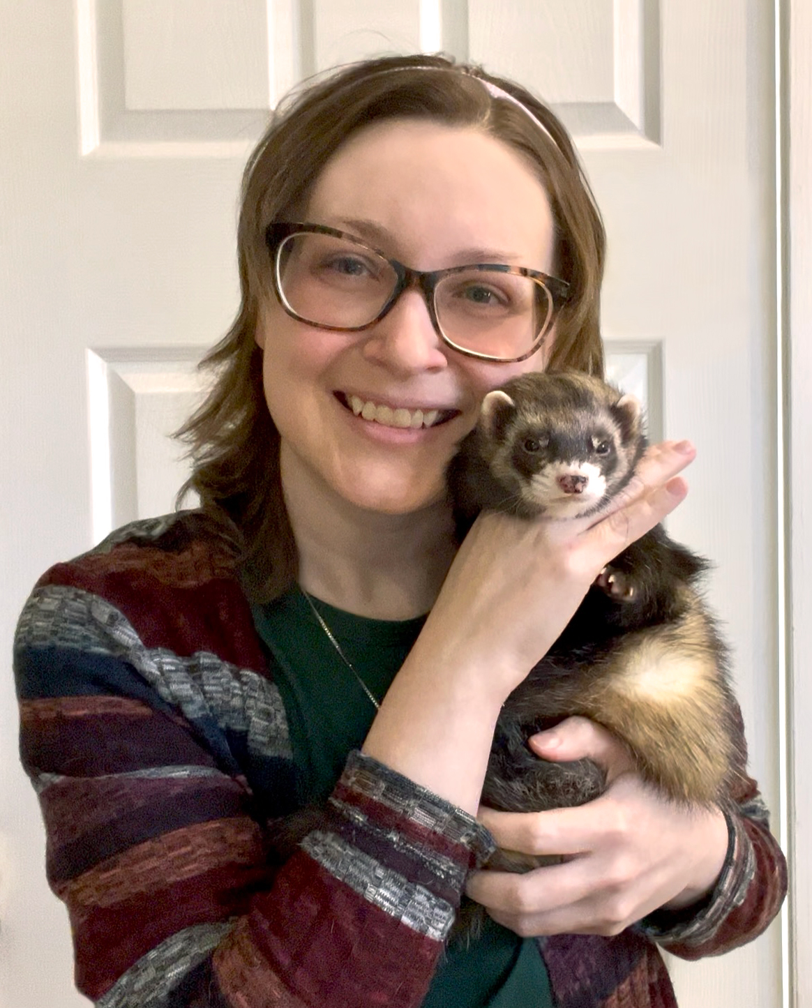 Photo of Lynn holding one of her ferrets